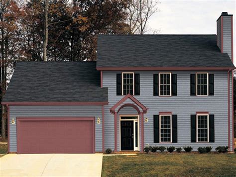 dark gray house with green metal roof|black roof with gray siding.